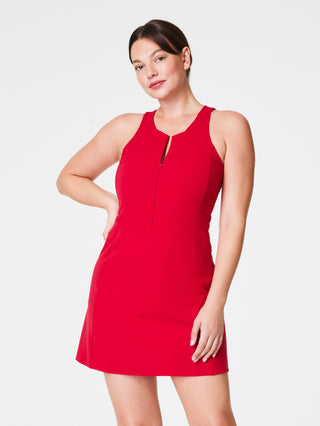 a sporty red spanx shape mini dress with hidden shorts and a zipper