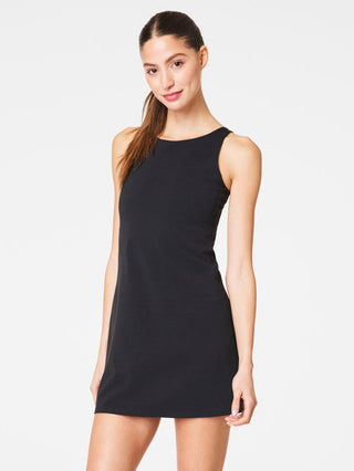 a sporty black spanx shape high neck mini dress with hidden side pockets