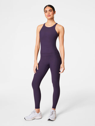 buttery soft aubergine purple spanx high rise leggings worn with white sneakers