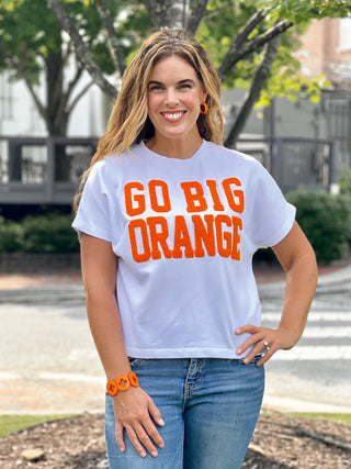 a classic white game tee with go big orange printed on the front