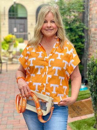 a button front tennessee orange blouse with short angled sleeves and high collar