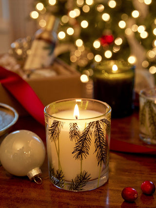 a classy holiday scented candle with a pretty pine needle design