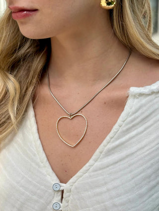 large open cz gold heart on a sleek silver round snake chain necklace