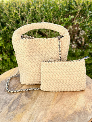 a creamy beige woven hobo handbag with matching cosmetic pouch