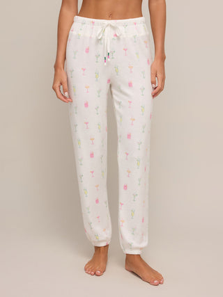 a pair of white lounge joggers with cocktail print