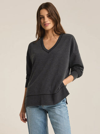 oversized black pullover sweater with   v neck long sleeves and side slits 