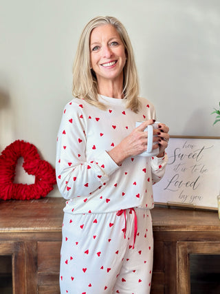 a soft white long sleeve pajama top with red hearts