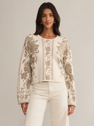 a soft cream and brown intarsia knit floral pattern sweater